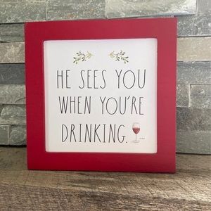 Rae Dunn wooden sign
“He Sees You When You’re Drinking”
